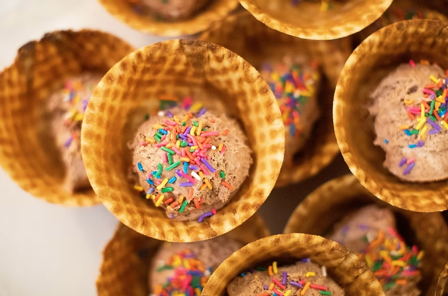 Ice cream cones with chocolate ice cream and sprinkles